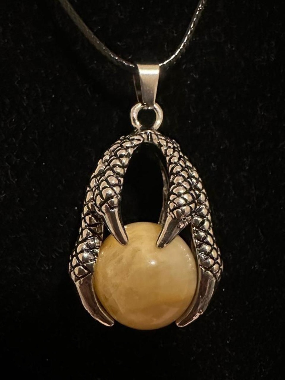 Silver dragon claw pendant necklace with big yellow aventurine crystal ball.